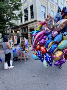 Kids buying balloons