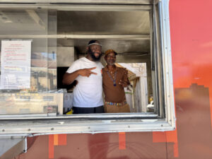 Father and son running a food truck together